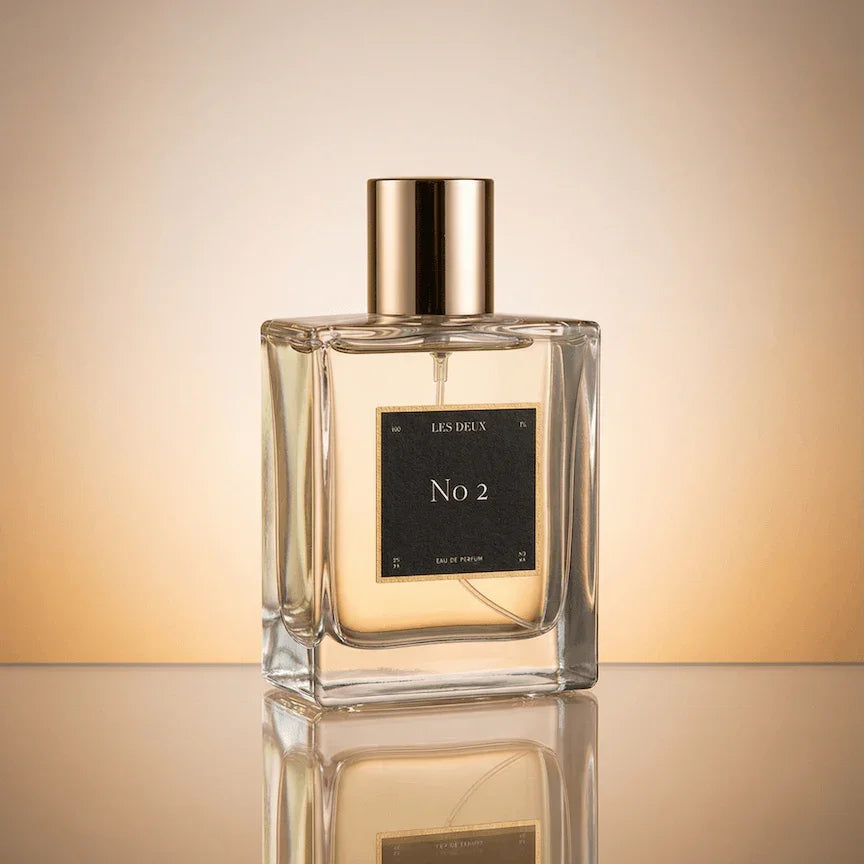 Les Deux Fragrances No. 2 Peau d'Or perfume bottle with amber and gold tones on a neutral background