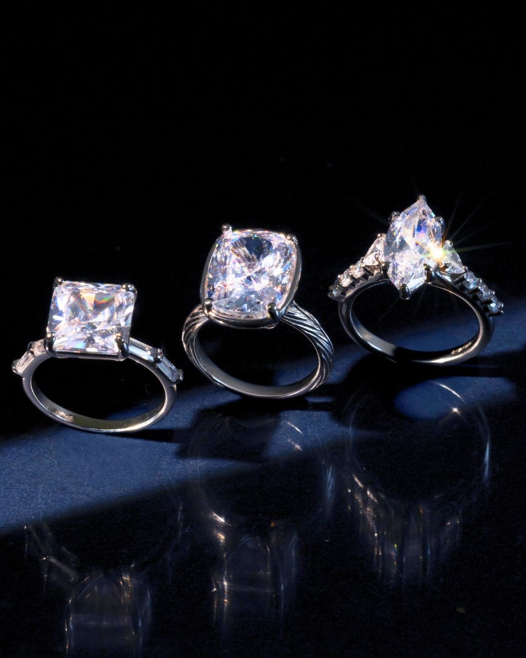 Elongated cushion-cut cubic zirconia cocktail ring in gold-plated sterling silver on a hand, showing large faceted stone and slim band