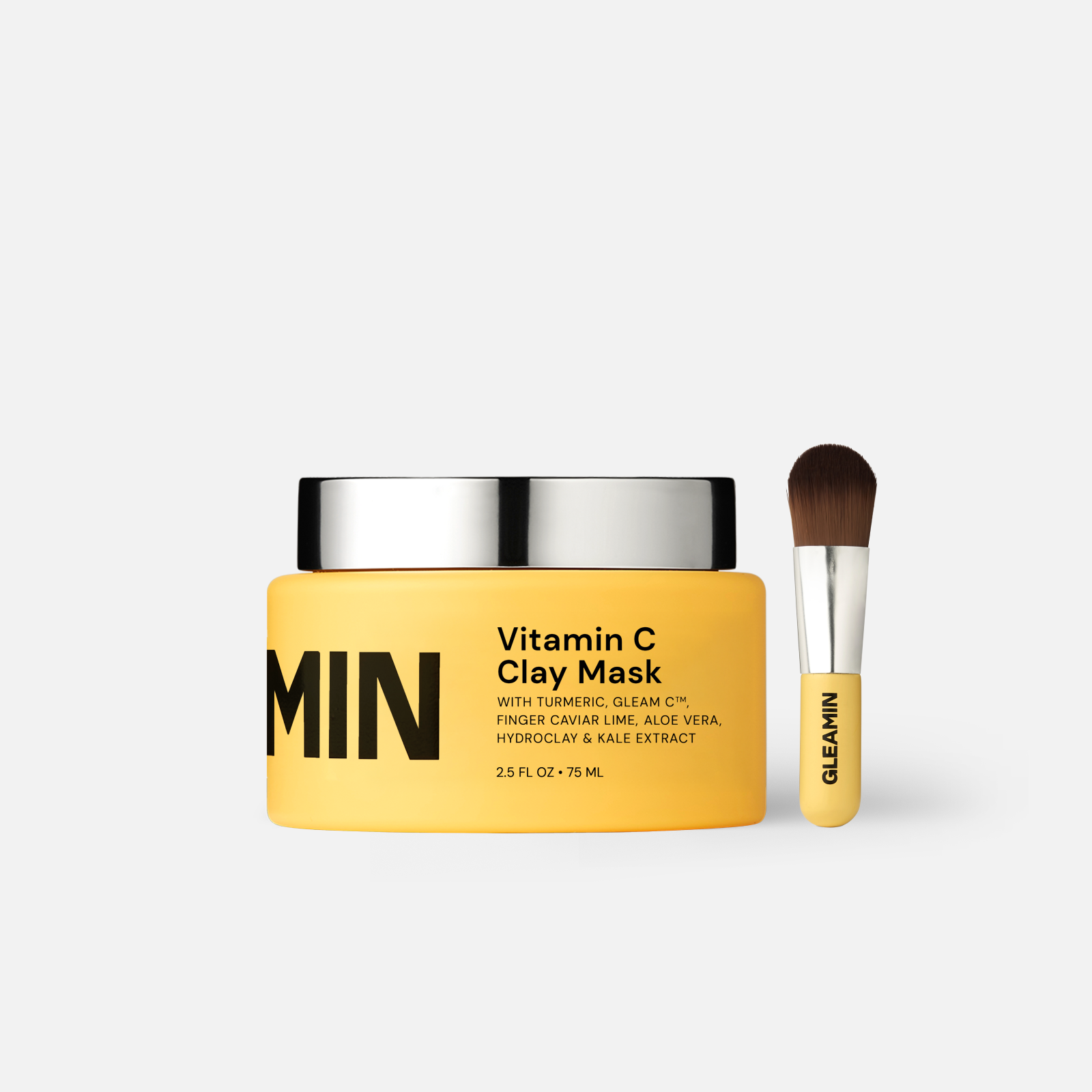 Vitamin C clay mask in jar with turmeric-toned formula, shown with Australian botanical ingredients on a clean white surface