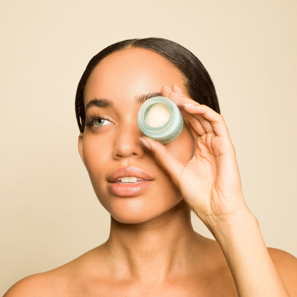 Olga Lorencin Skincare The Eye Cream 0.5 oz jar with Master Blend peptide and niacinamide formula on a neutral background