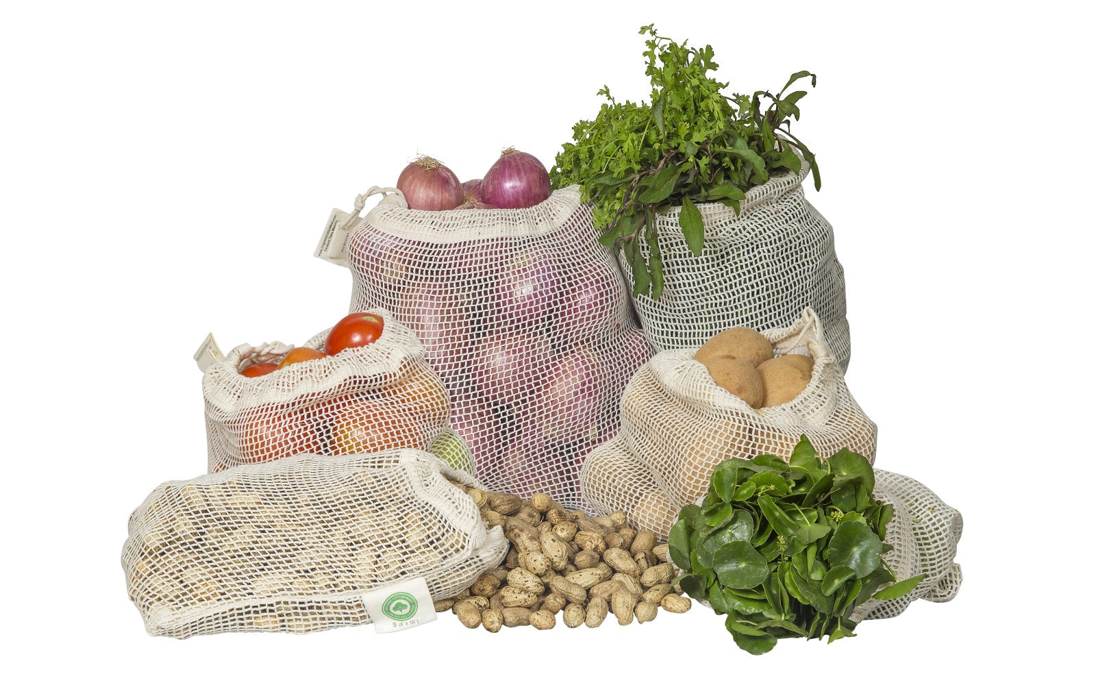 Set of reusable organic cotton mesh produce bags in multiple sizes filled with fresh vegetables