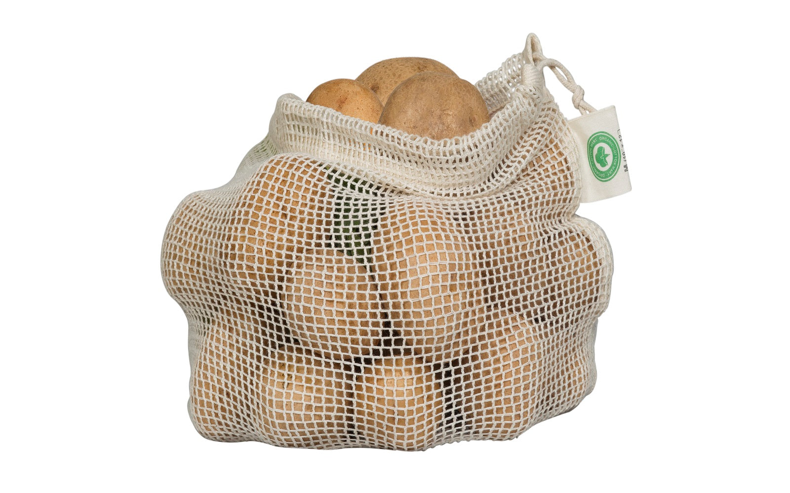 Set of reusable organic cotton mesh produce bags in multiple sizes filled with fresh vegetables