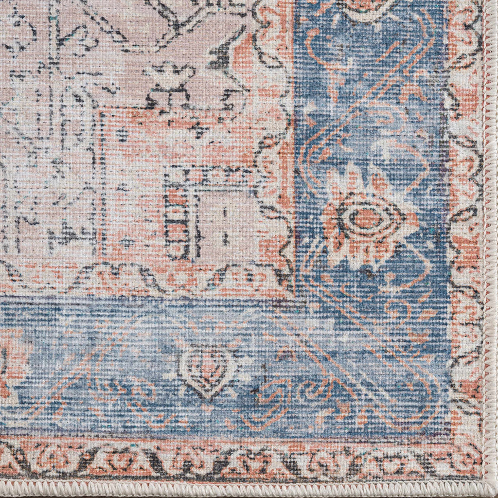 Rosman distressed flat weave area rug in warm red, blue, and earthy tones with vintage-inspired pattern