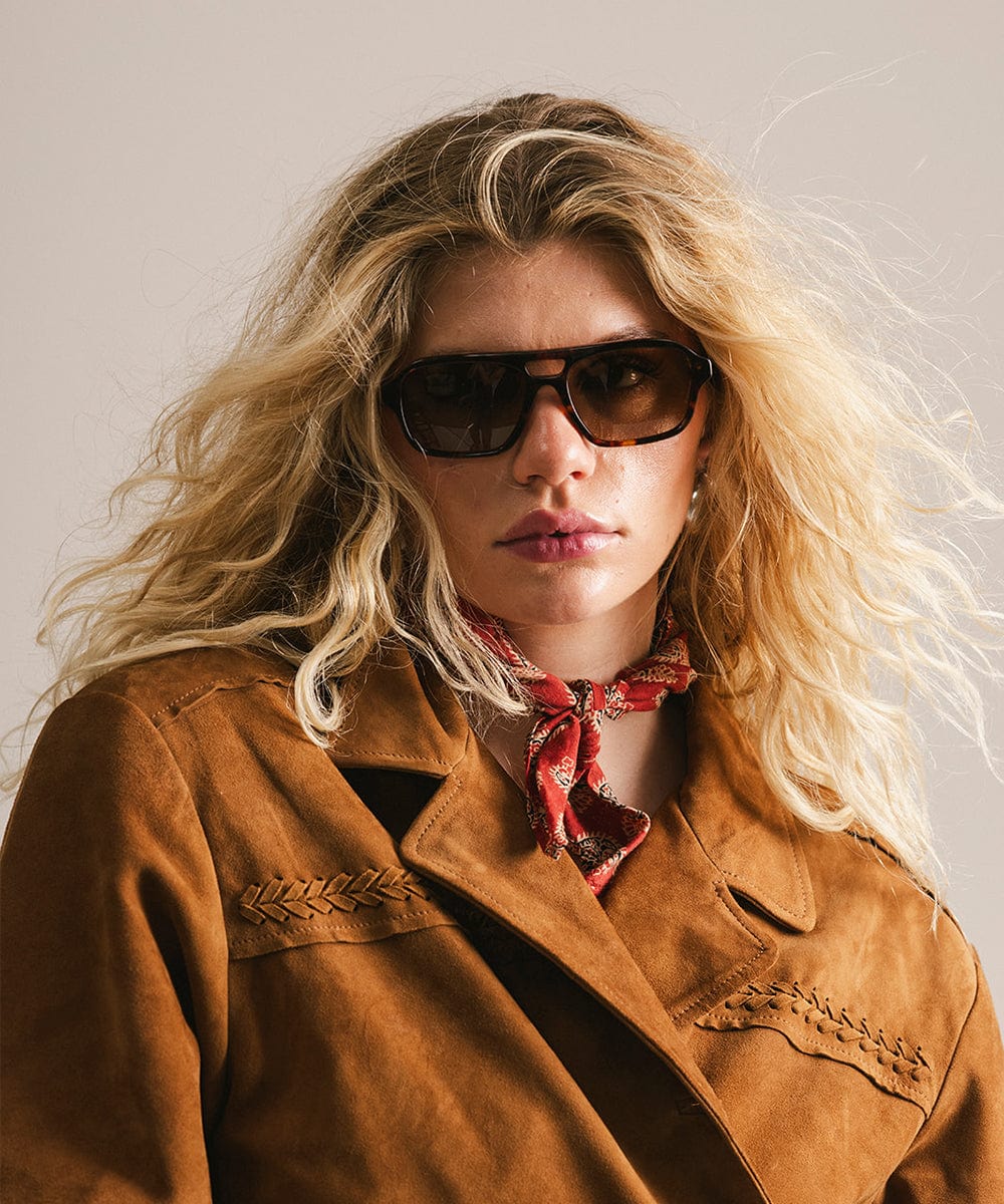 Men's rectangular vintage-inspired aviator sunglasses with light lenses and a gold-tone frame, shown with leather storage case