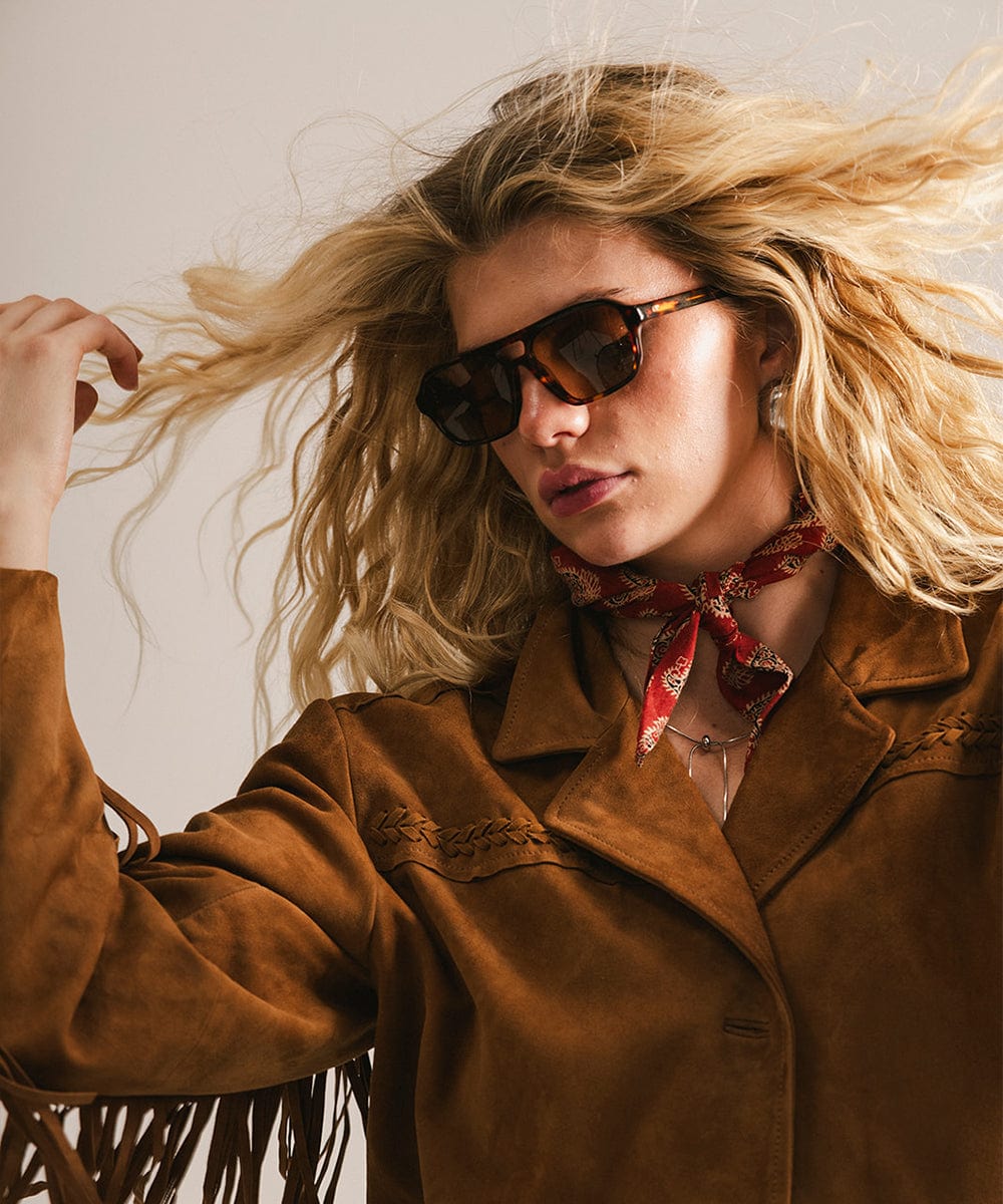 Men's rectangular vintage-inspired aviator sunglasses with light lenses and a gold-tone frame, shown with leather storage case