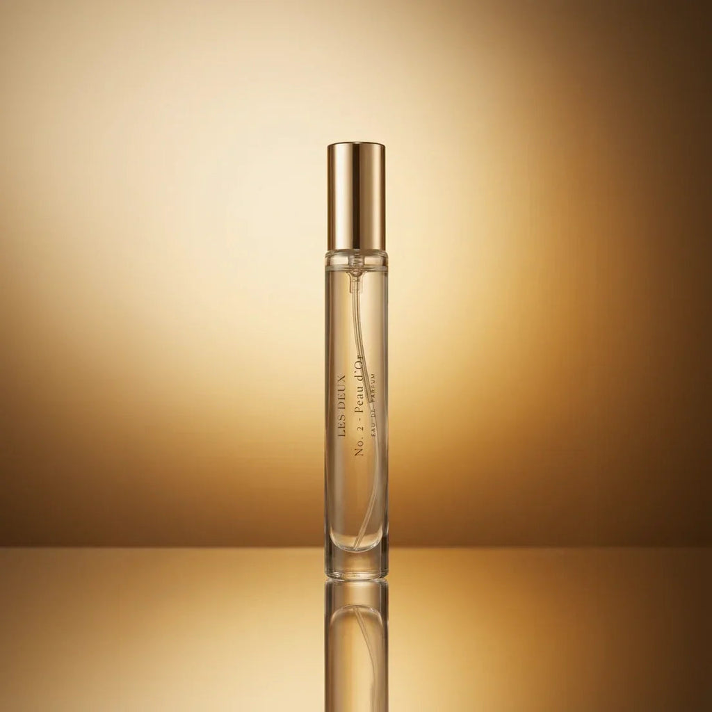 Les Deux Fragrances No. 2 Peau d'Or perfume bottle with amber and gold tones on a neutral background
