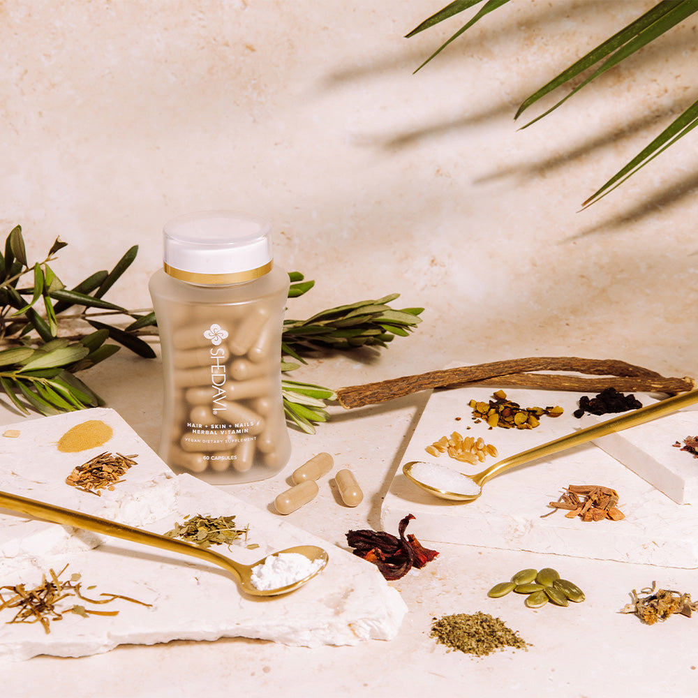 Shedavi herbal hair growth vitamin bottle with botanical ingredients on a clean neutral background