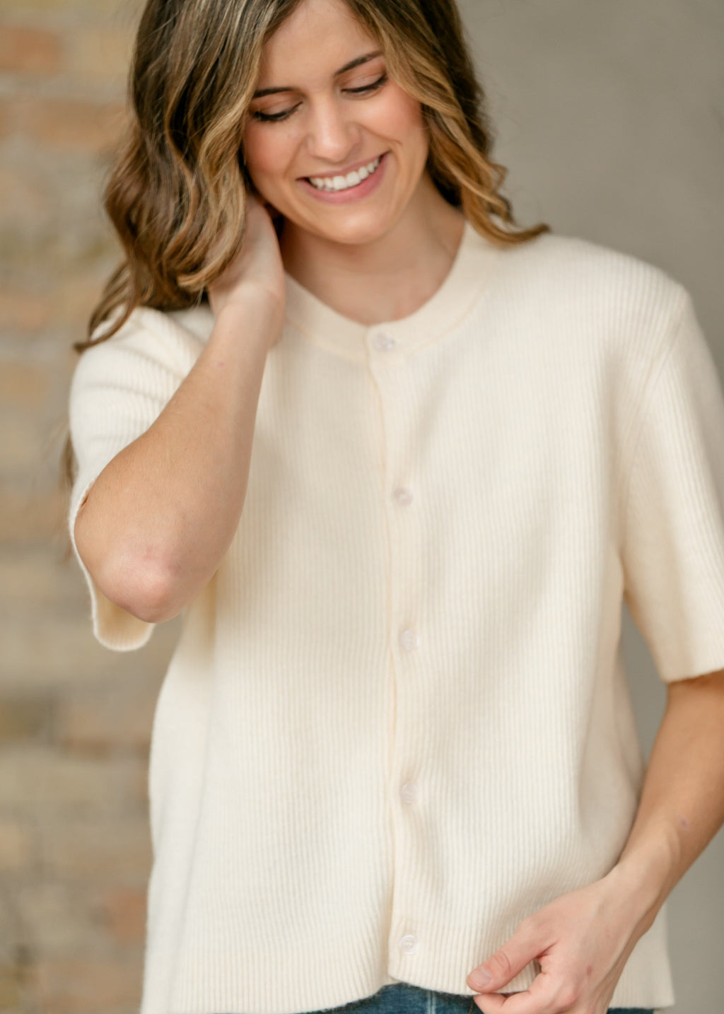 Oversized ivory short-sleeve button cardigan in soft cotton-rayon knit with vertical texture and crew neckline