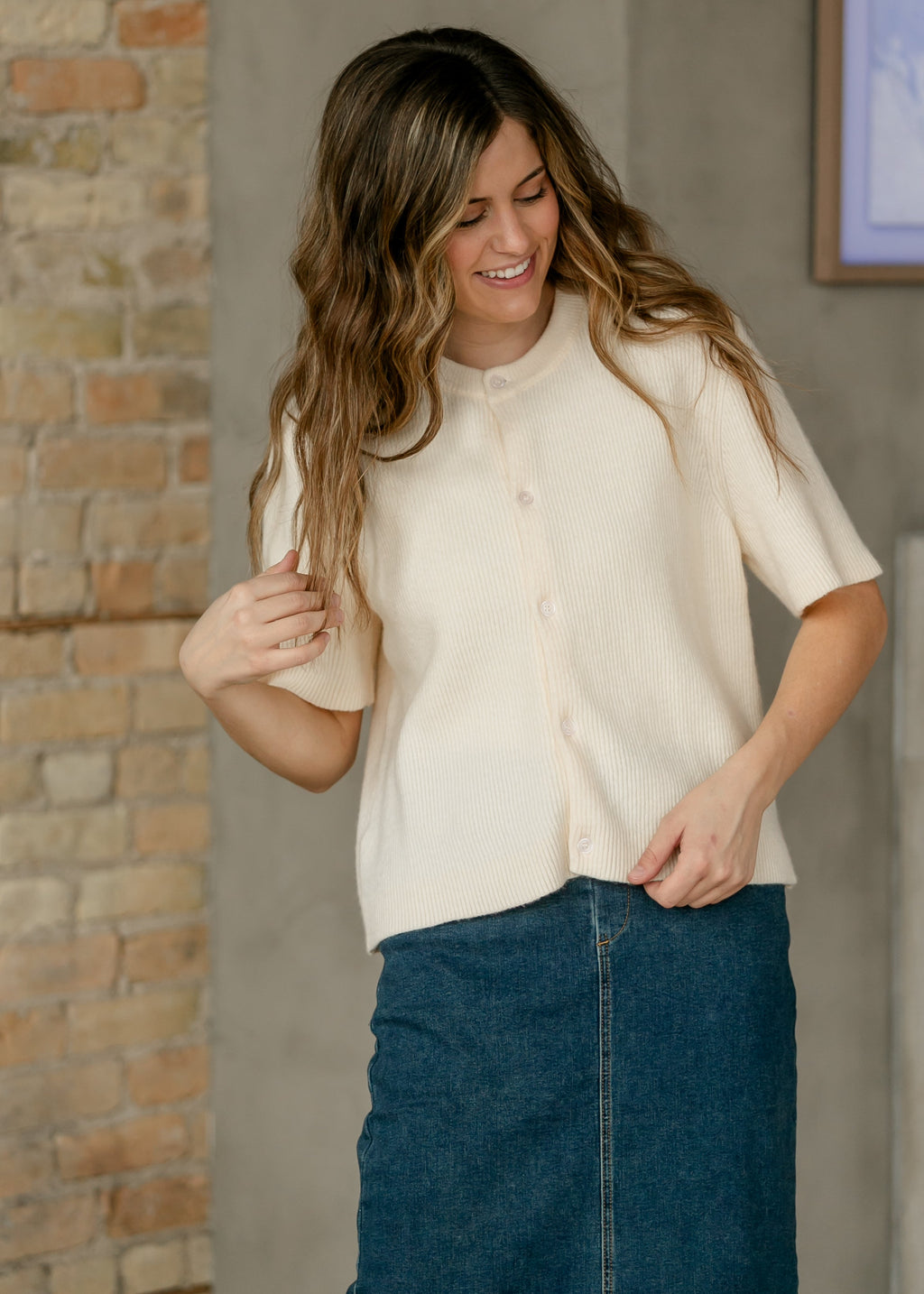 Oversized ivory short-sleeve button cardigan in soft cotton-rayon knit with vertical texture and crew neckline