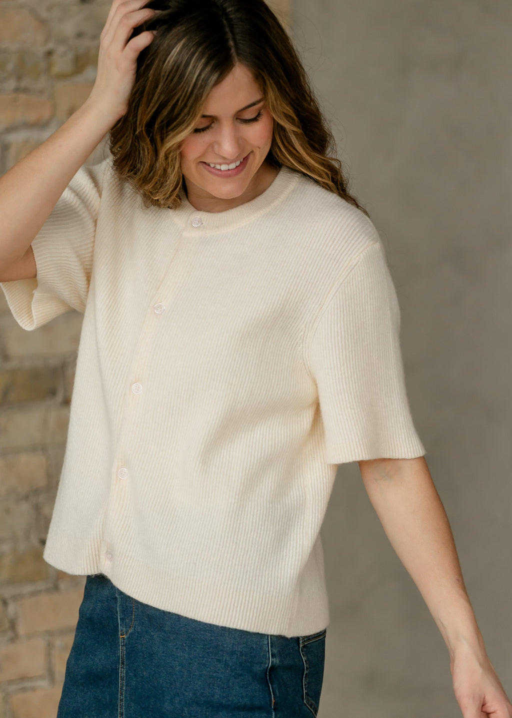 Oversized ivory short-sleeve button cardigan in soft cotton-rayon knit with vertical texture and crew neckline