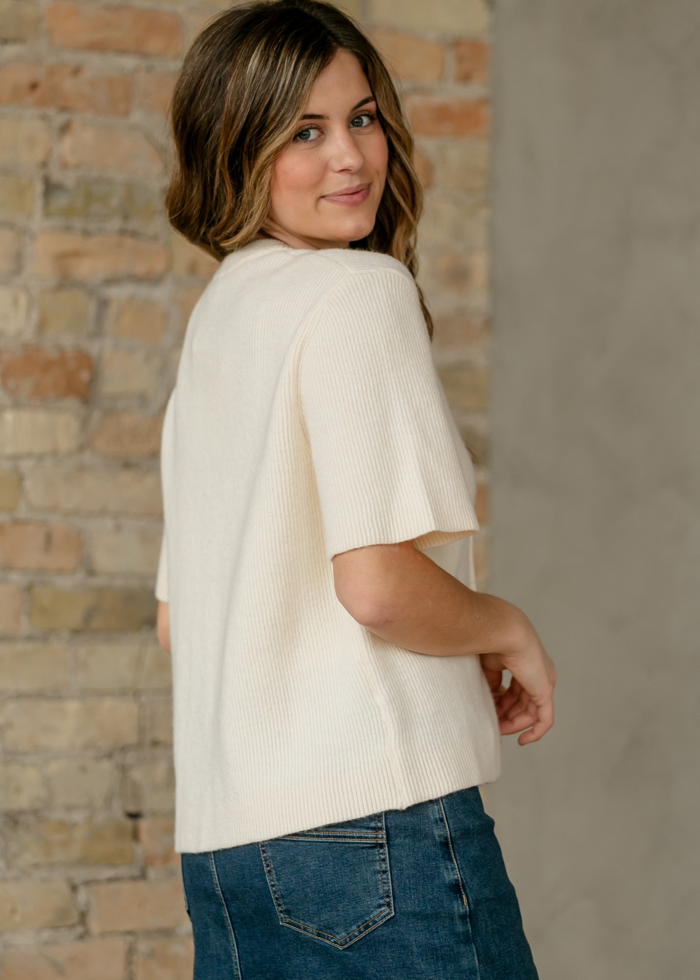 Oversized ivory short-sleeve button cardigan in soft cotton-rayon knit with vertical texture and crew neckline