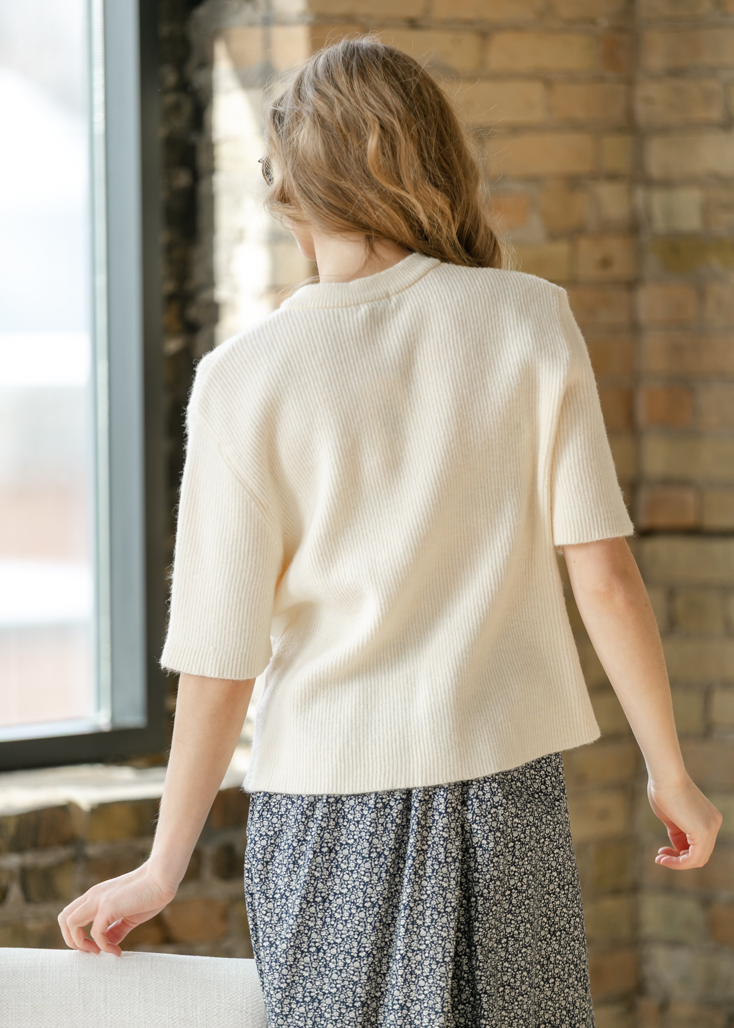 Oversized ivory short-sleeve button cardigan in soft cotton-rayon knit with vertical texture and crew neckline