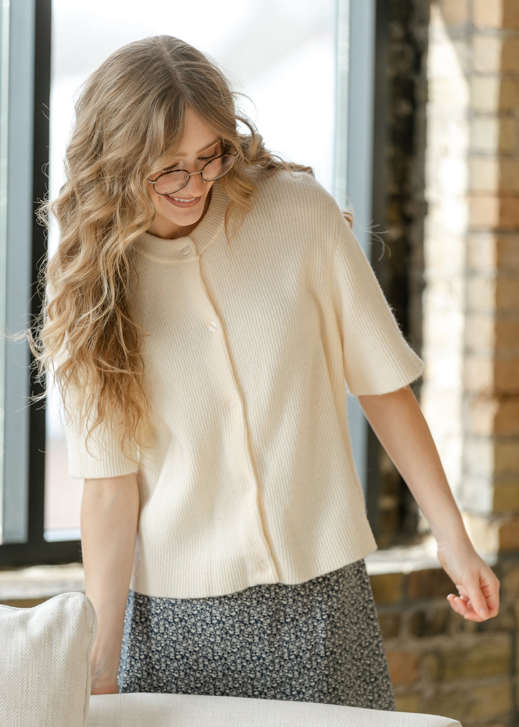Oversized ivory short-sleeve button cardigan in soft cotton-rayon knit with vertical texture and crew neckline