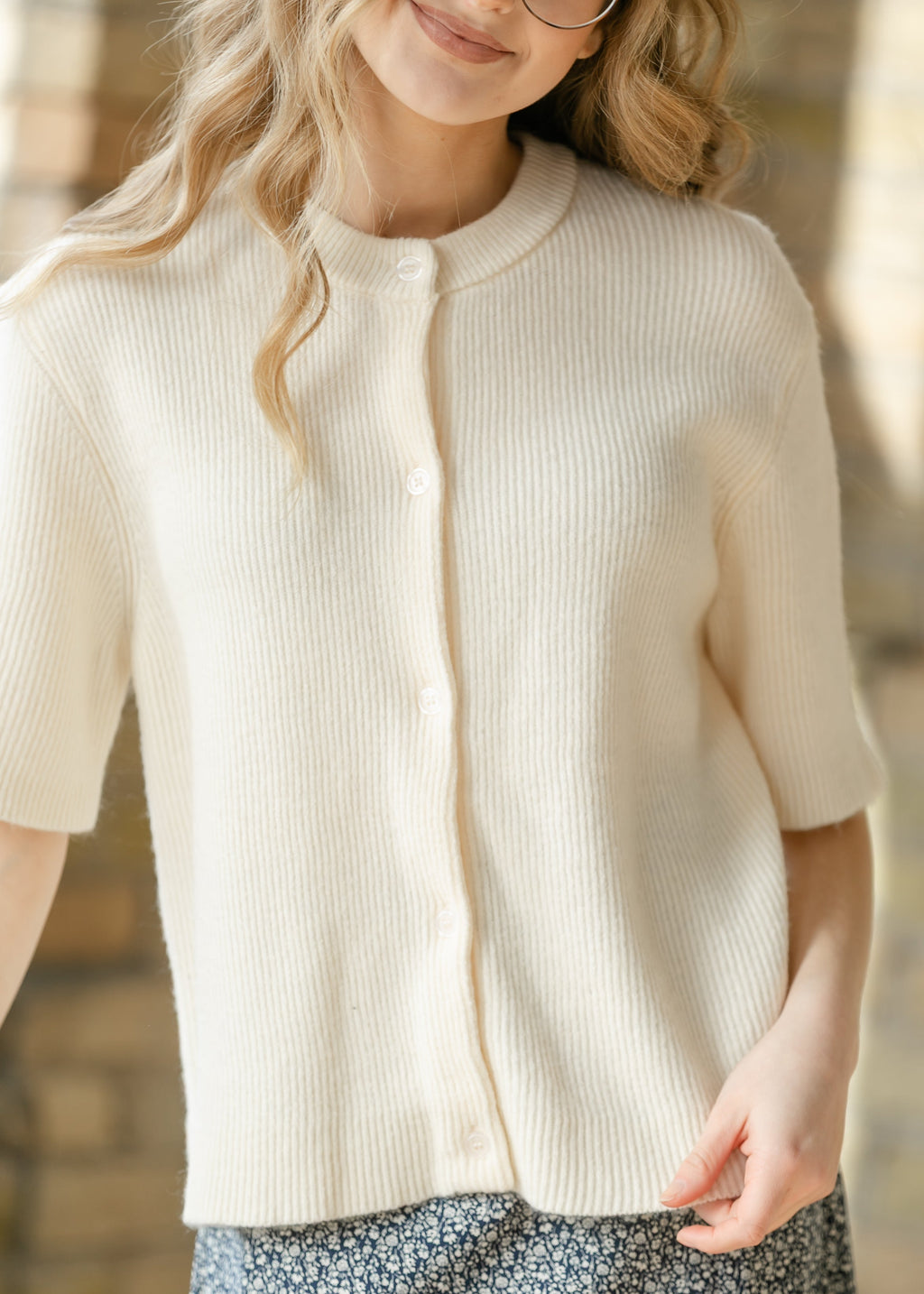 Oversized ivory short-sleeve button cardigan in soft cotton-rayon knit with vertical texture and crew neckline